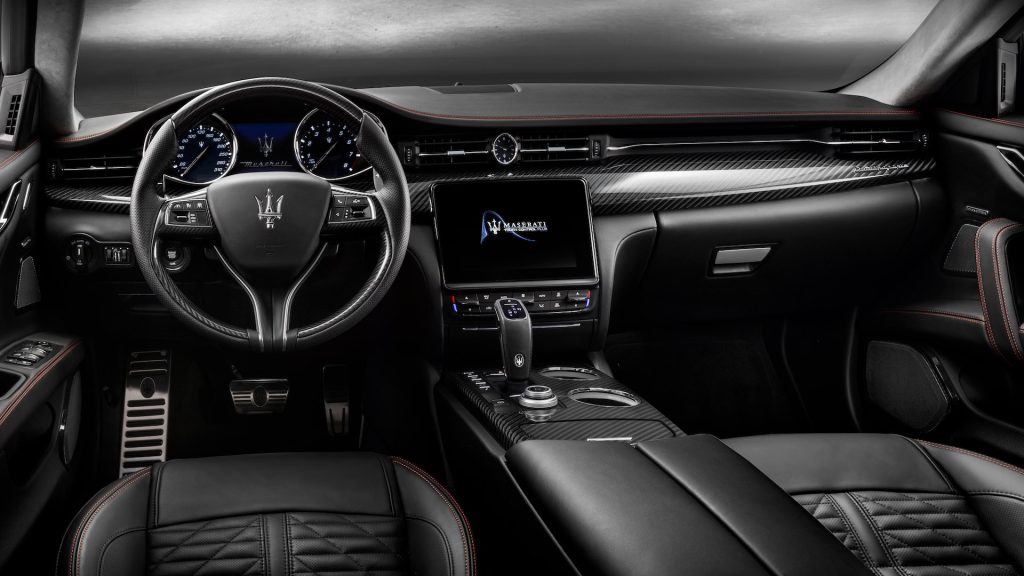 Luxury Maserati interior with leather seats, digital dashboard, and central touchscreen, designed for comfort and safer, distraction-reducing driving